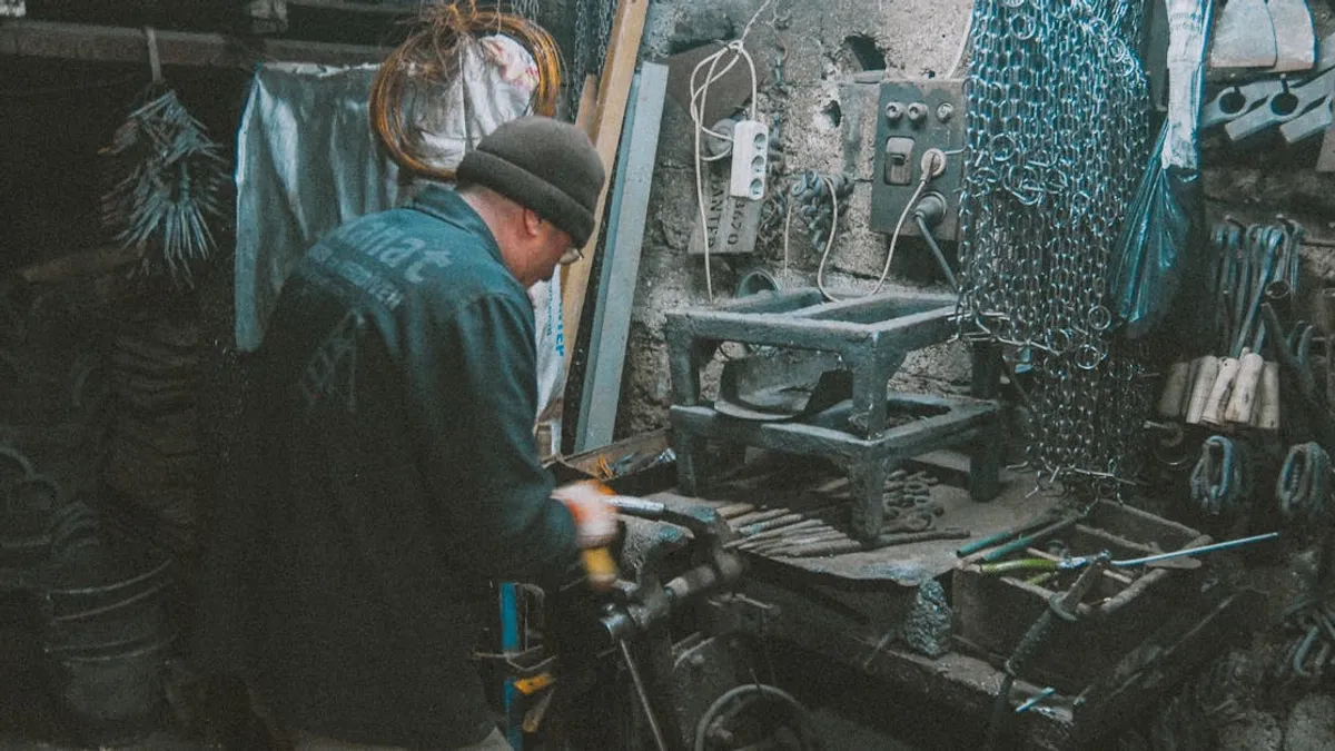 A blacksmith in a workshop shaping metal with various tools and equipment around.